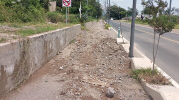 PHOTONOTE: Gravel and rocks continue to wash onto on the bicycle path