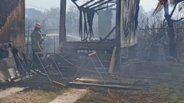 Grassland fire destroys warehouse