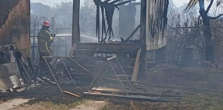 Grassland fire destroys warehouse