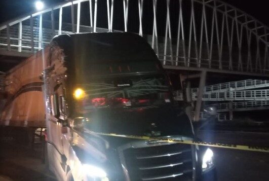 Trucker has heart attack while driving and hit a pedestrian bridge