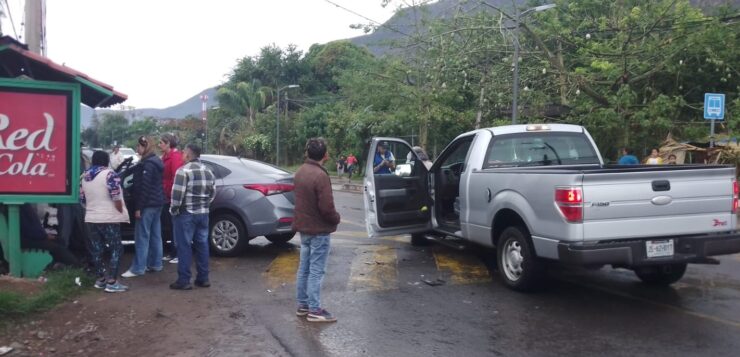 Car rear-ended on wet pavement in San Juan Cosalá