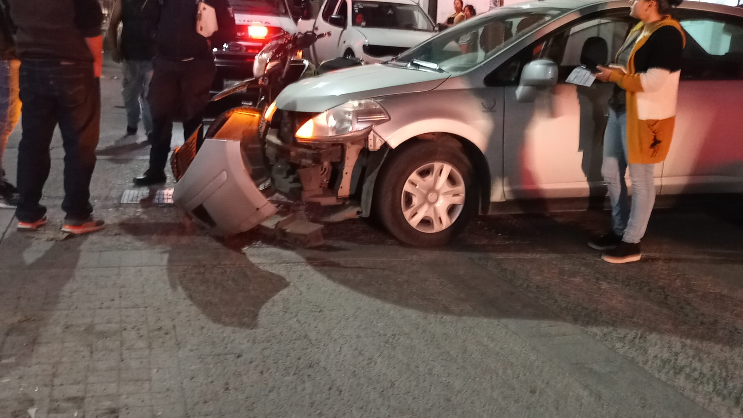 Motorcycle, car collide in downtown Jocotepec