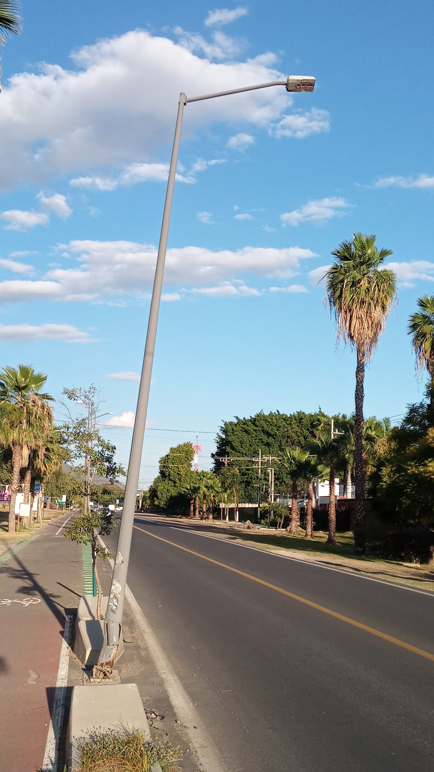 PHOTONOTE: Another streetlight tilts on the cycle path