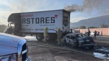 Car and freight truck crash, burst into flames on highway