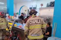 People flee the Chapala market as fire erupts in butcher shop