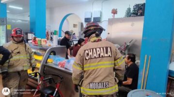 People flee the Chapala market as fire erupts in butcher shop