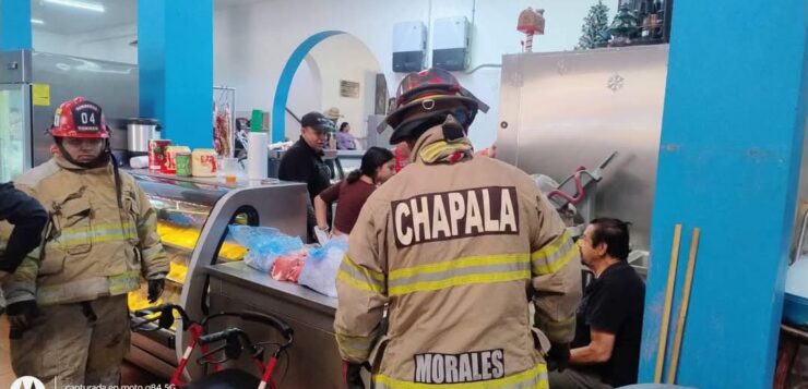 People flee the Chapala market as fire erupts in butcher shop