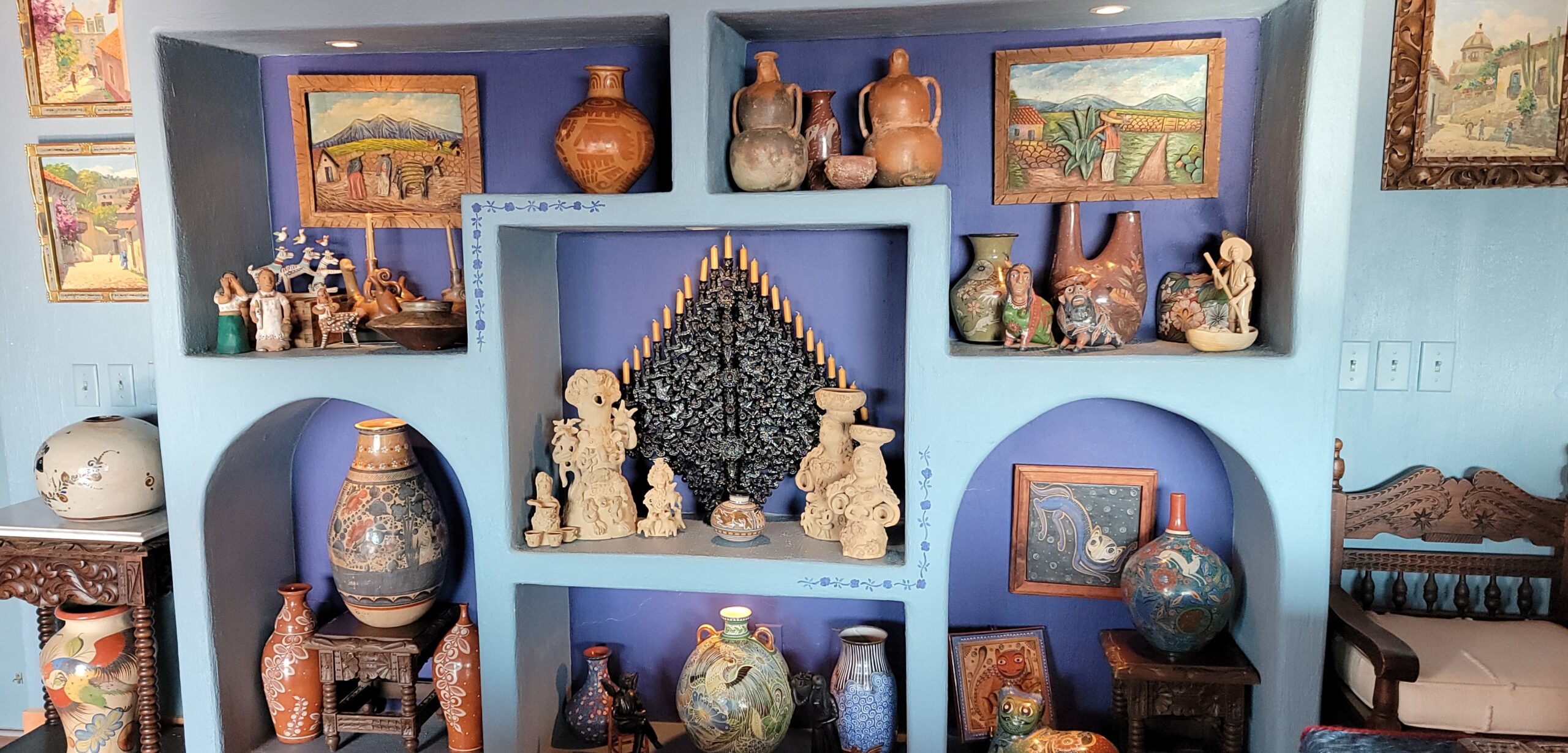 Photo 1: Candelabra as a focal point surrounded by ceramics in Cathy Merrill's living room. Photo: Patrick O’Heffernan.